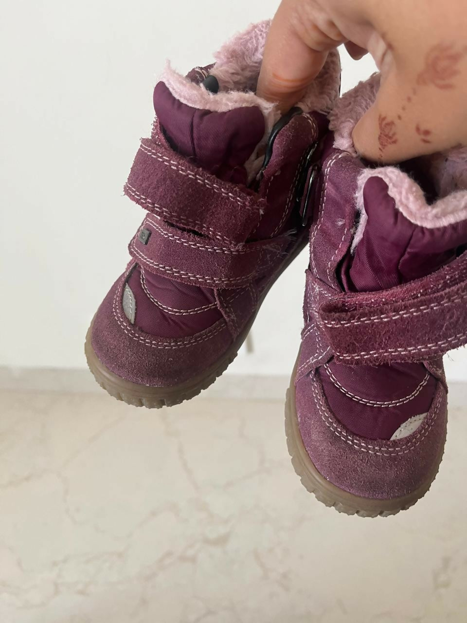 Keep your baby girl's feet warm and stylish with our Purple Colored Boots, featuring plush lining and secure closure for all-day comfort.