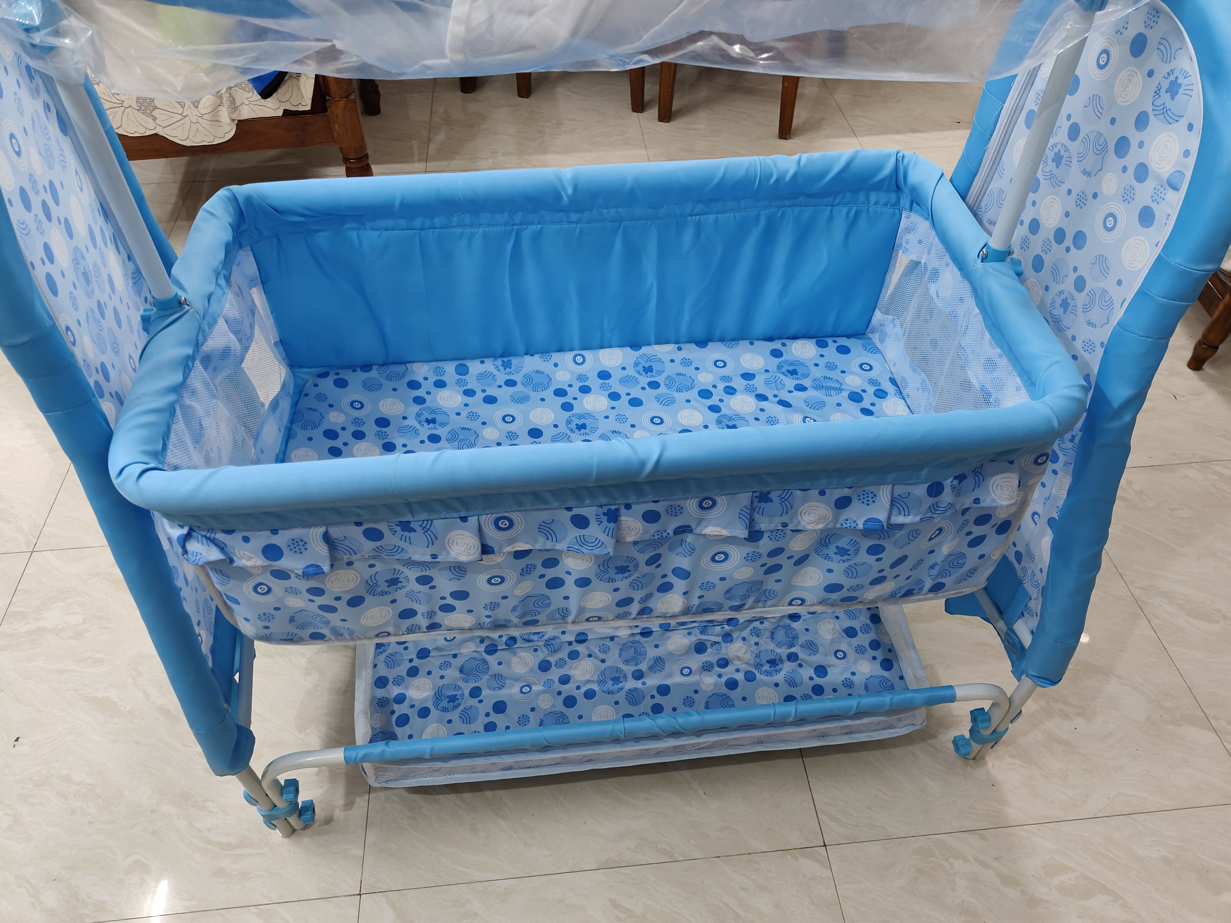 Comfortable blue baby cradle with gentle rocking motion—perfect for safe, soothing sleep at home or on the go!