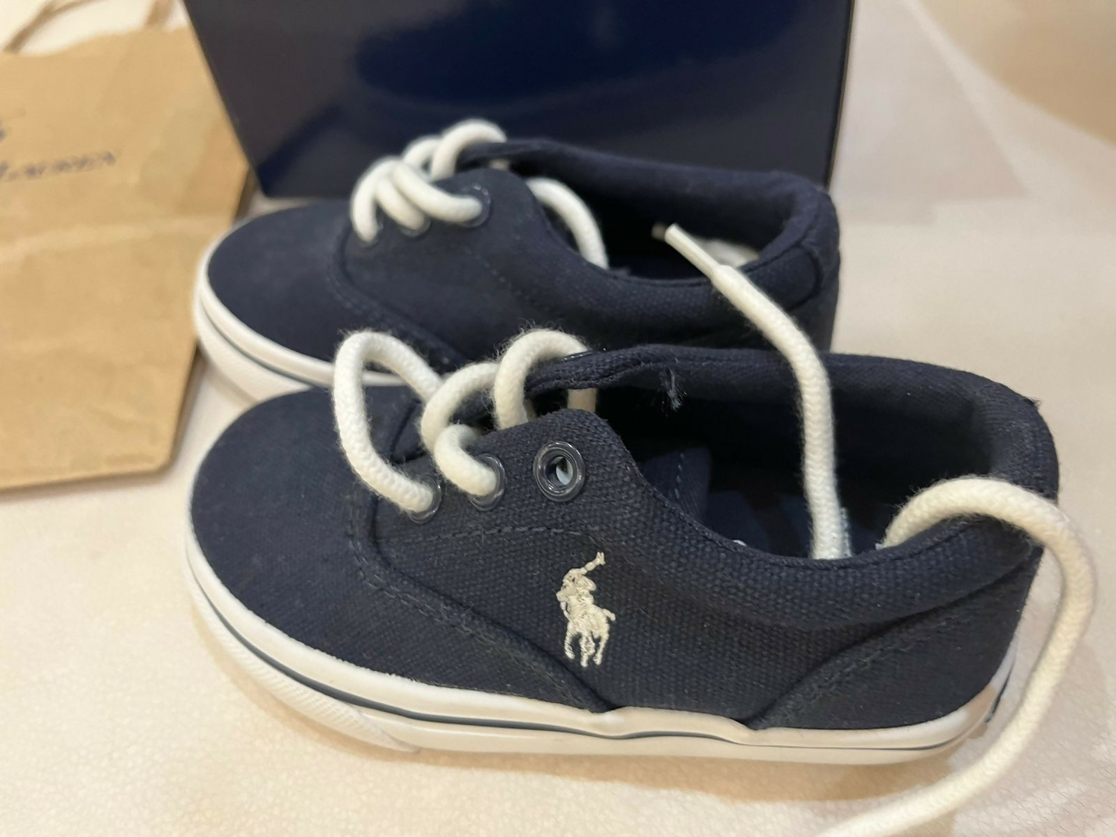 Premium Ralph Polo baby shoes from Europe with stylish design, breathable comfort, and non-slip soles for safety and elegance.