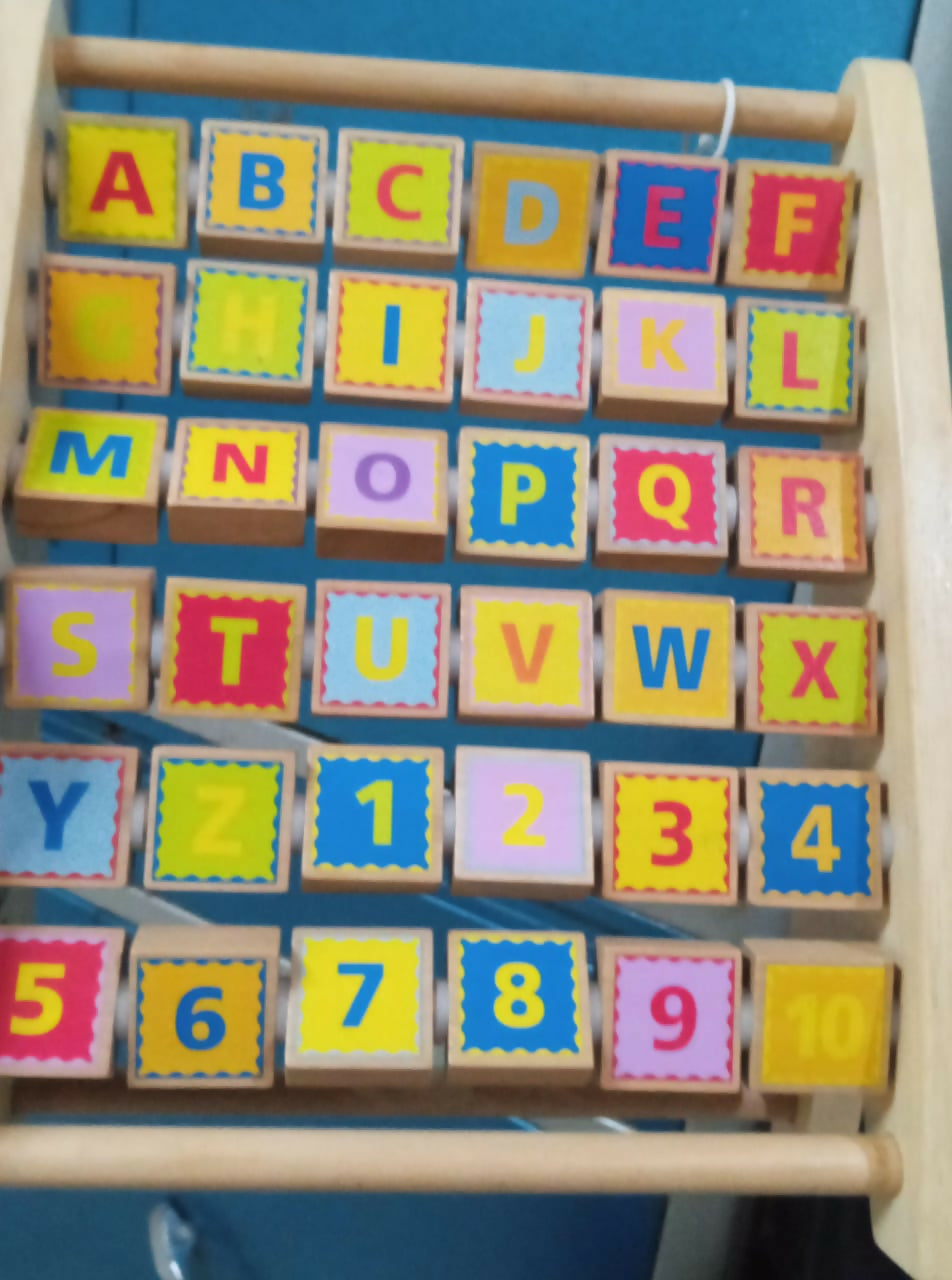 Enhance your child's early math and literacy skills with the Hape Alphabet Abacus Wooden Counting Toy – featuring colorful beads for counting and alphabet blocks for letter recognition, crafted from high-quality, durable wood.