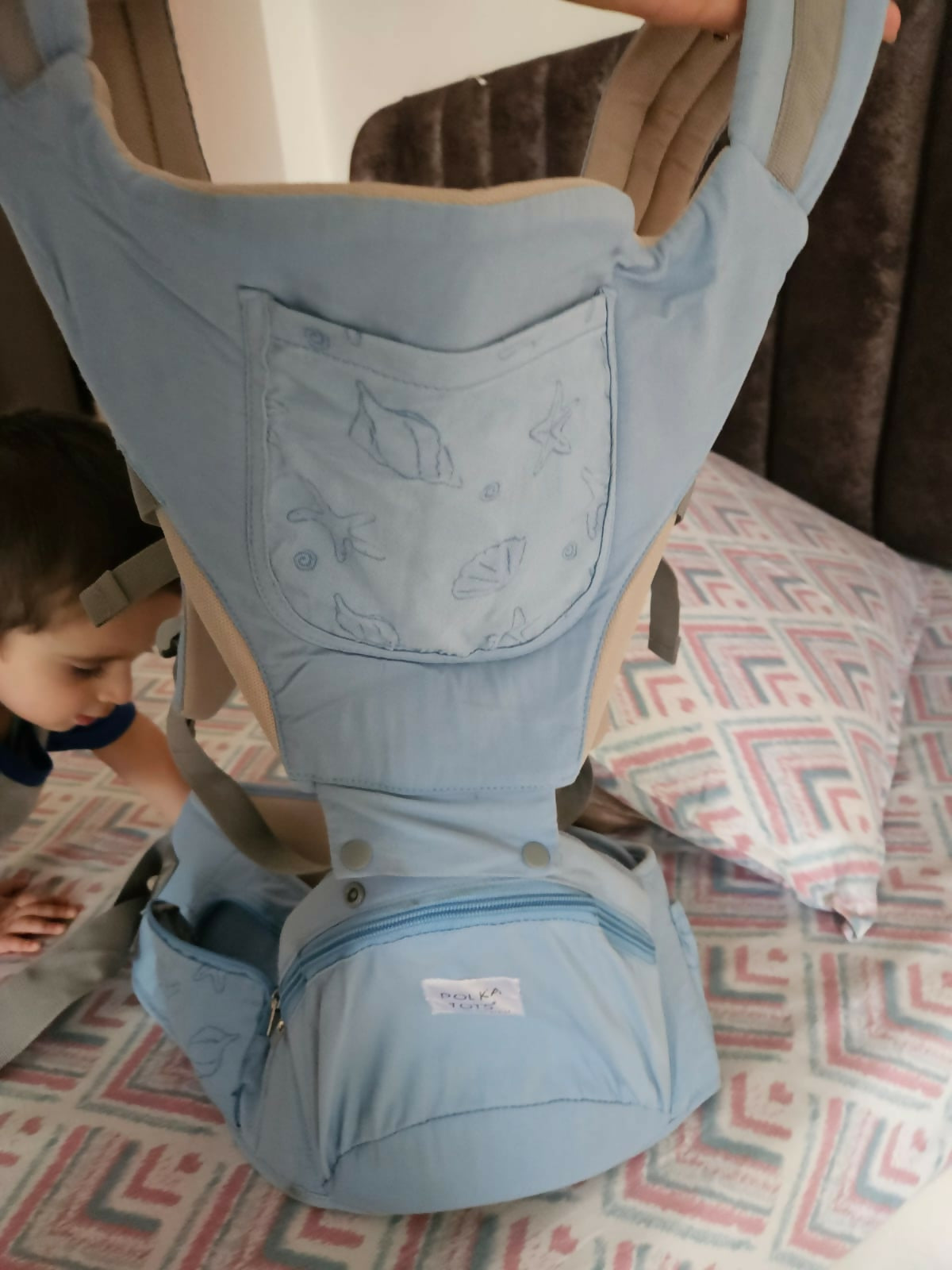 Shop now for the POLKA TOTS Baby Carrier/6 In 1 Convertible Hip Seat in Shell Blue, offering six carrying positions, ergonomic support, and adjustable straps for babies 3-36 months!