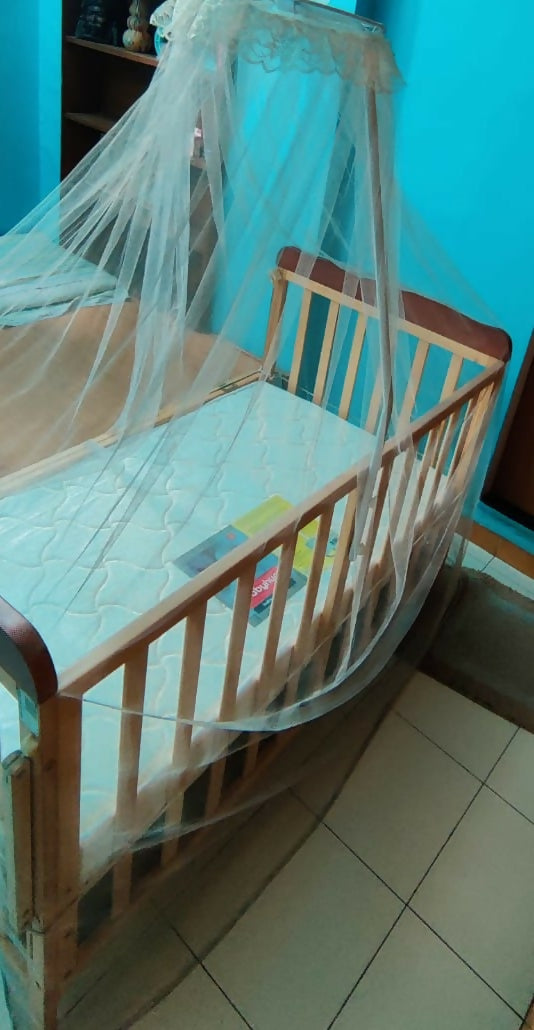 Discover the BABYHUG Hamilton Wooden Cot/Crib with Mosquito Net and BABYHUG Mattress, providing a safe, comfortable, and insect-free sleeping environment for your baby.