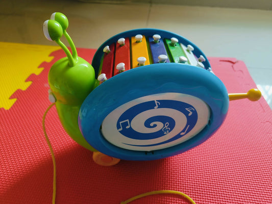 Giggles Funskool Musical Snail - A playful, musical toy that encourages sensory and motor skill development for babies and toddlers.