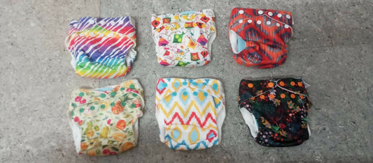 SuperBottoms UNO Freesize Cloth Diaper for babies with adjustable fit and organic cotton pad for comfort and eco-friendly protection.