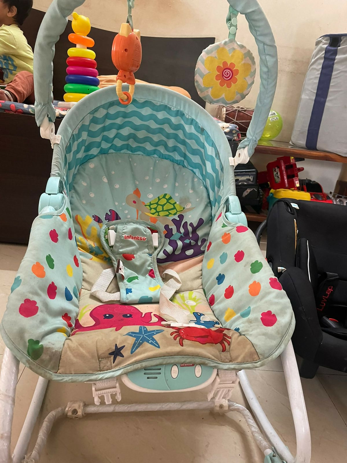 Soothe, entertain, and protect your baby with the INFANTSO Baby Rocker & Bouncer—complete with calming vibrations, music, a mosquito net, and more!