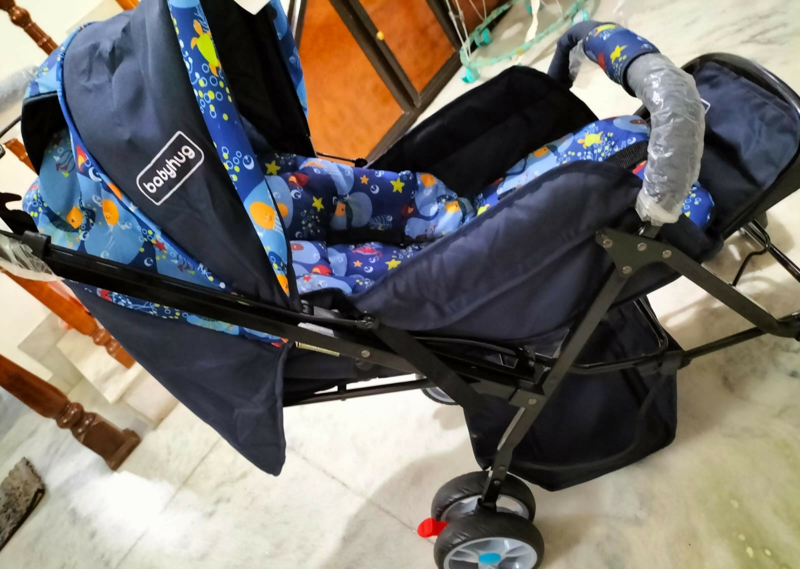 Comfortable and secure BABYHUG Stroller/Pram with a 5-point safety harness, multi-position reclining seat, and easy foldable design.