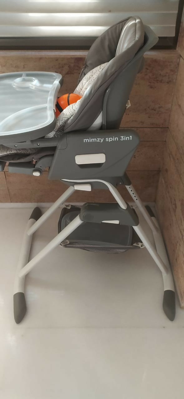 Mimzy Spin 3-in-1 High Chair: 360° rotation, adjustable recline, and stylish geometric design for growing babies.