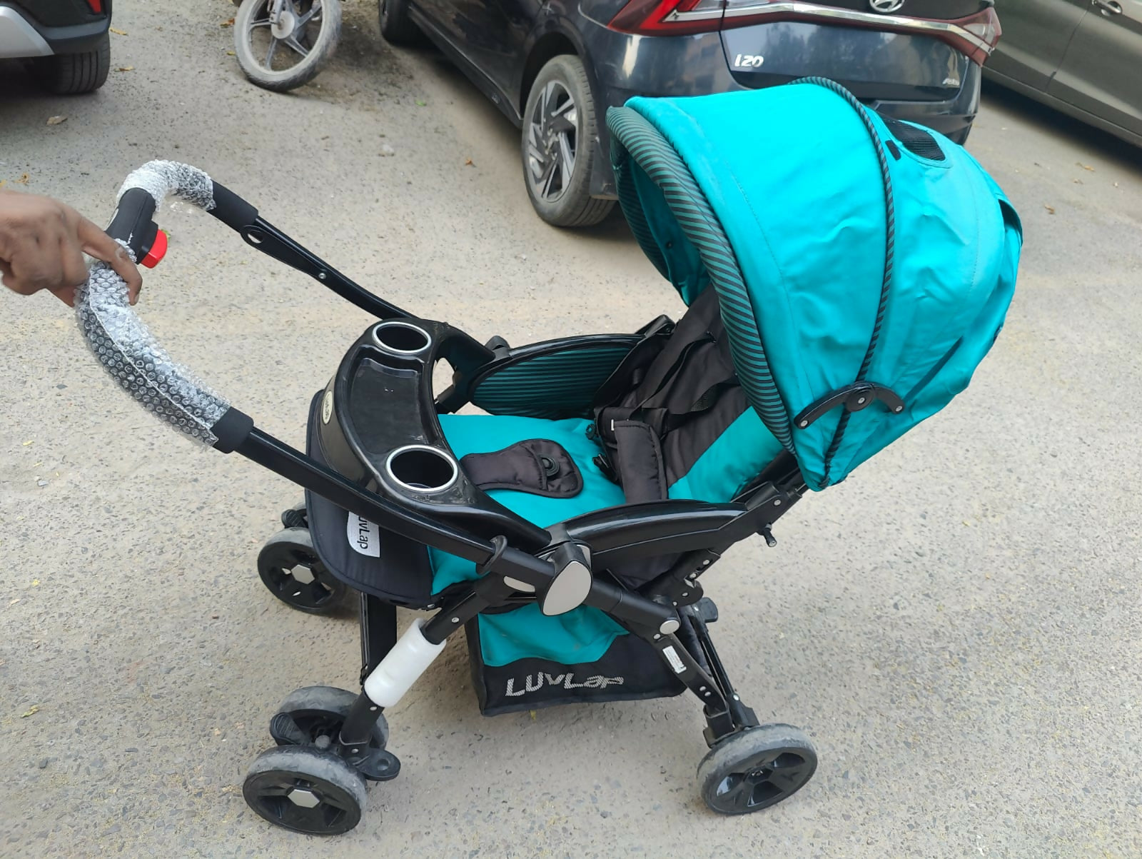 Enjoy stress-free outings with your baby with the LUVLAP Galaxy Stroller/Pram, featuring a comfortable seat, adjustable canopy, and convenient one-hand fold mechanism for easy storage and transport.