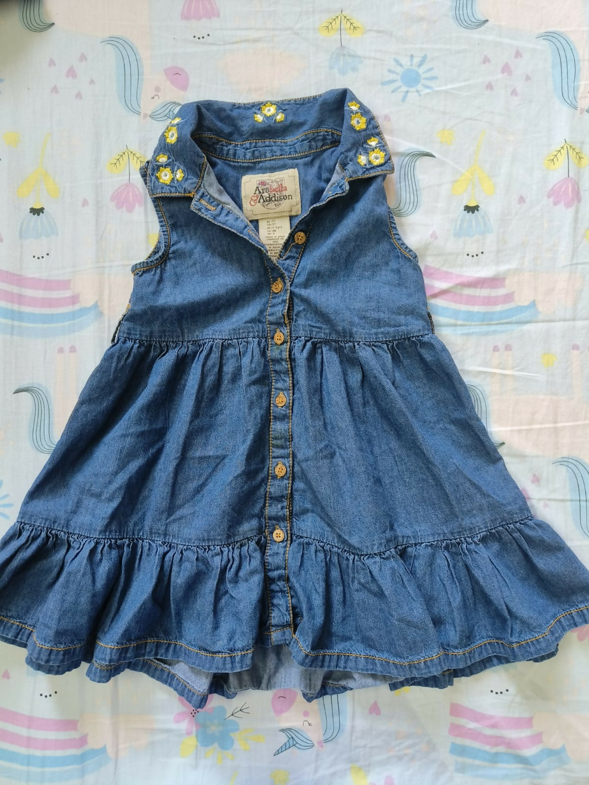 Dress your baby girl in timeless style with ARABELLA & ADDISON Denim Frock/Dress, crafted for elegance and comfort.