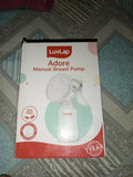 Enjoy comfortable and convenient milk expression with the LUVLAP Adore Manual Breast Pump – featuring a soft silicone cushion, compact design, and three included bottles for easy storage and use.