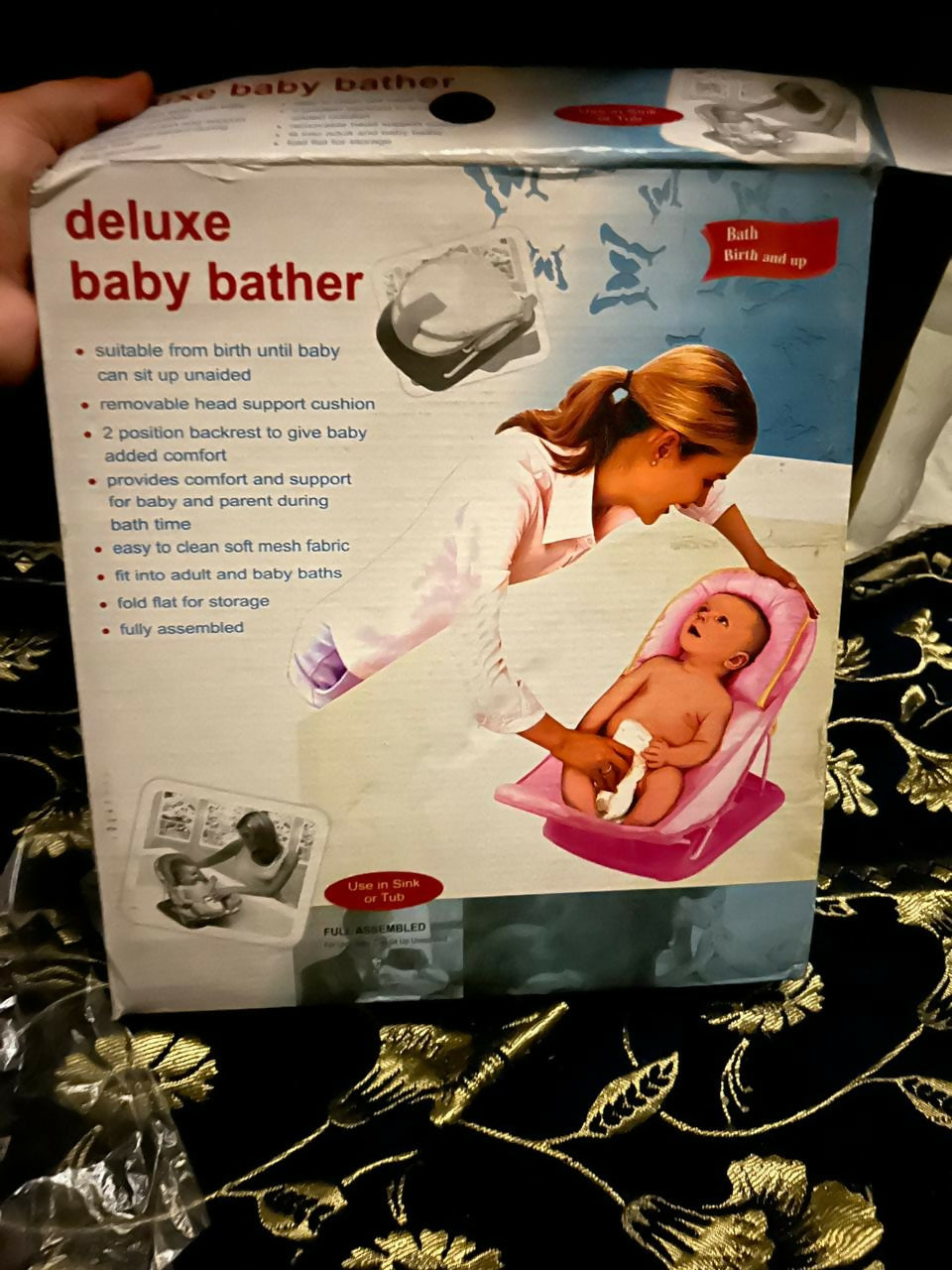 Discover the DELUXE Baby Bather, offering a secure mesh sling, ergonomic design, and easy storage for safe and comfortable baby baths.