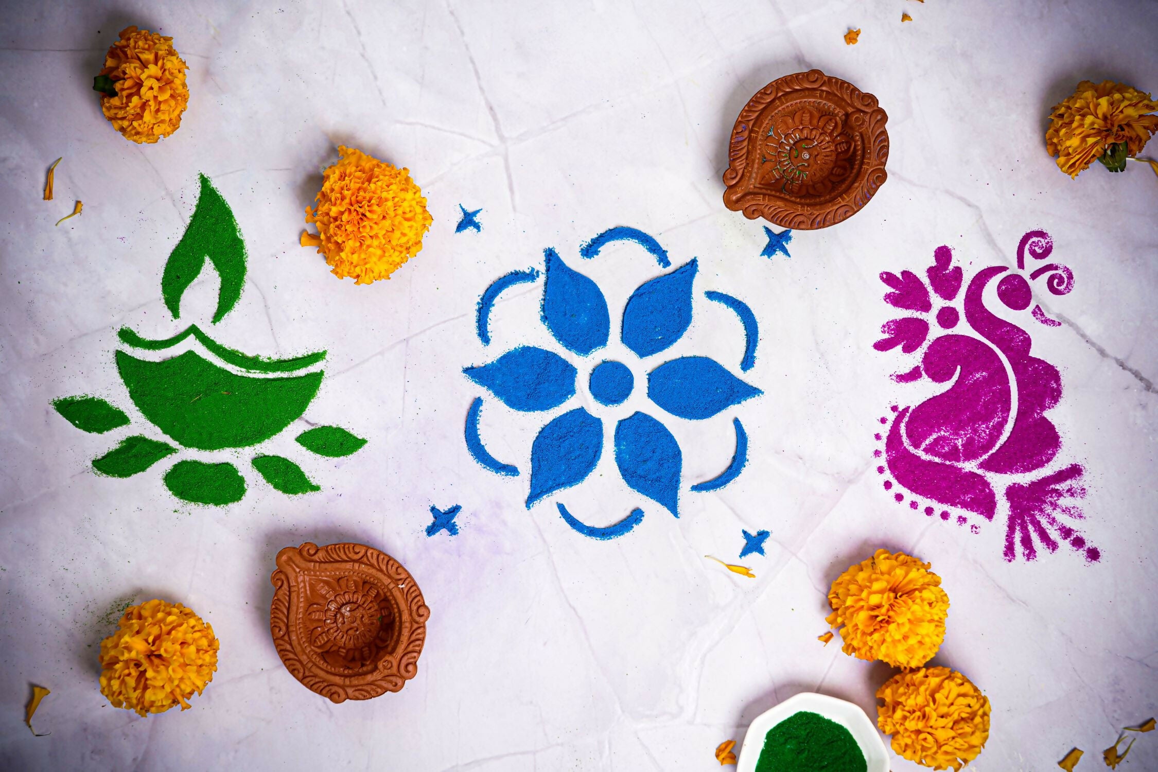 Elevate your festive celebrations with our DIY Rangoli Kit, a delightful set designed to add a touch of artistry and tradition to your home. This kit includes everything you need to create a beautiful rangoli, including a traditional stencil, six vibrant rangoli colors, and a charming diya.