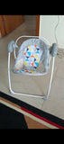 Automatic Swing with Multiple Speeds, Soothing Melodies, and Comfortable Seating for Babies.