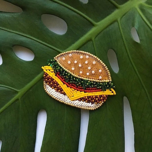 Make hairstyles fun with the Burger Chic Hair Clip – a quirky and delightful accessory for kids, designed in the shape of a delicious burger, perfect for adding charm and personality to any look.