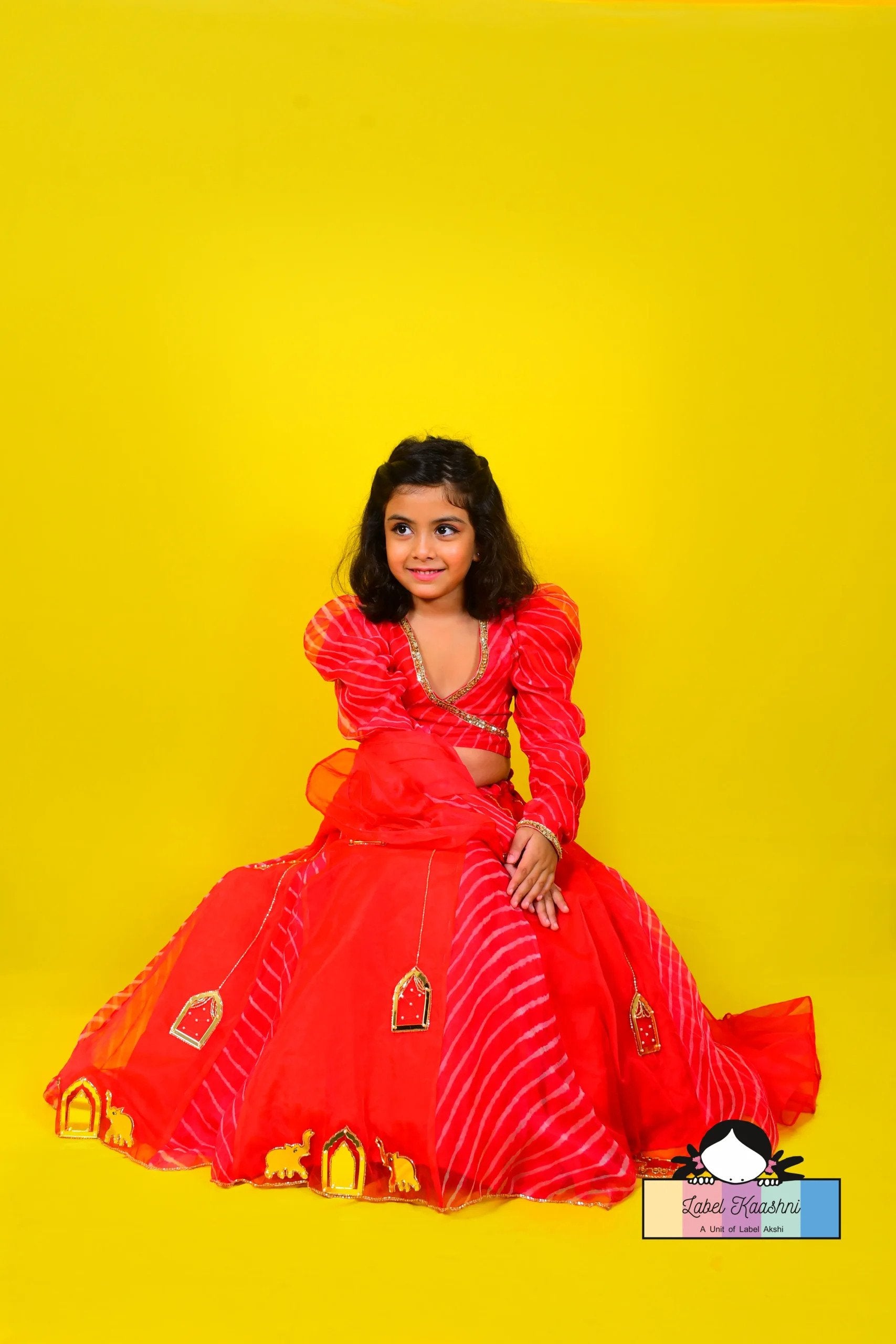 Elevate your child's festive look with the Razzleberry Lehenga – a cherry red ethnic ensemble perfect for kids' party wear, combining traditional elegance with modern style.