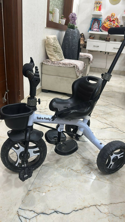 Give your baby a fun and safe riding experience with the Black Tricycle—perfect for early adventures with secure handling and a stylish design!