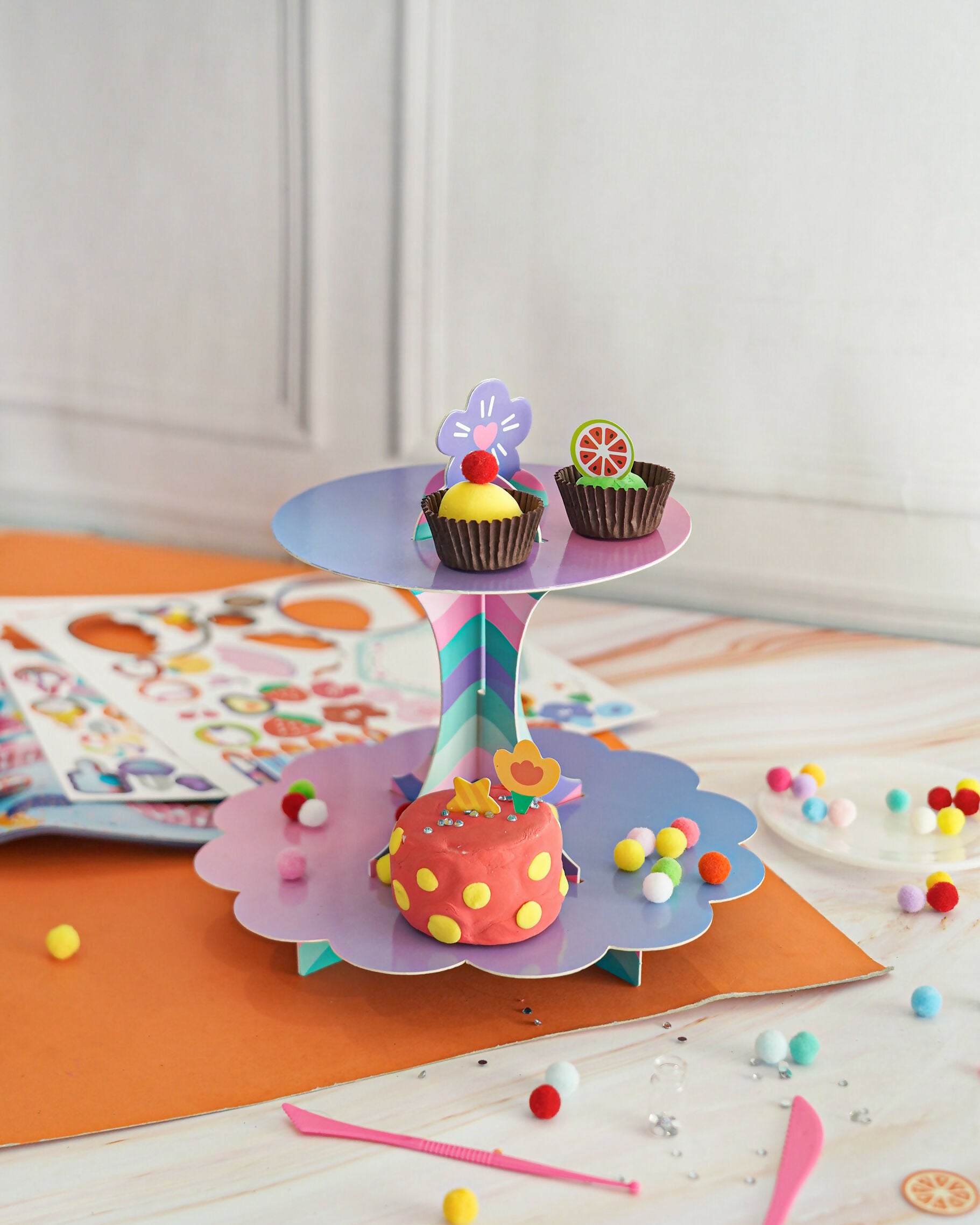 The ilearnngrow Dessert Clay Kit for Kids allows young artists to create their own miniature dessert masterpieces using colorful air-dry clay.