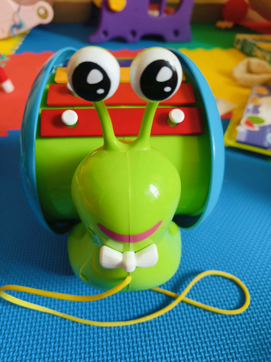 Giggles Funskool Musical Snail - A playful, musical toy that encourages sensory and motor skill development for babies and toddlers.