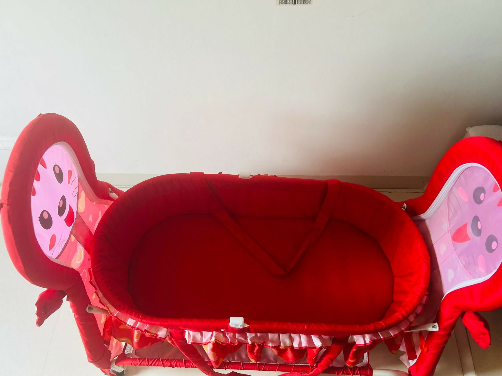 Fab and Funky Manual Cradle for Baby - Red: Sturdy, soothing, and stylish rocking cradle for newborns, with a vibrant red design and easy assembly.