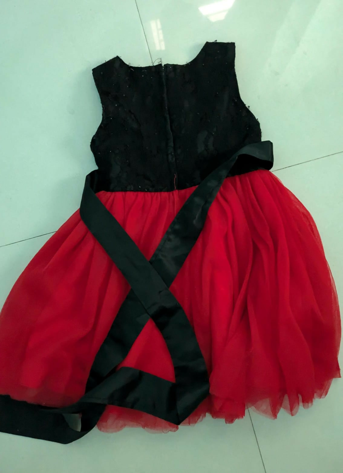 Beautiful red and black frock for baby girls, perfect for parties, birthdays, and festive events with stylish and comfy design.