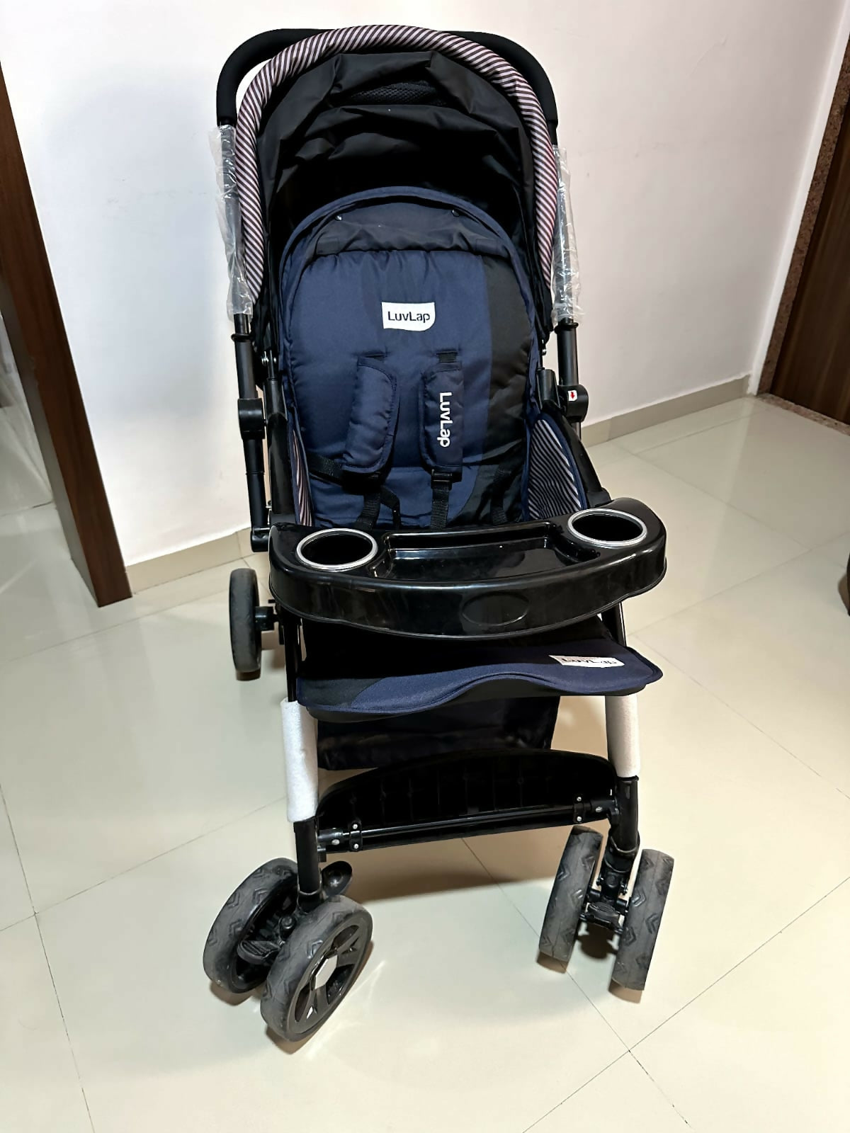 Experience ultimate comfort and safety with the LUVLAP Galaxy Stroller/Pram – featuring multi-position reclining seat, sturdy wheels, and reversible handle for easy travel with your baby.