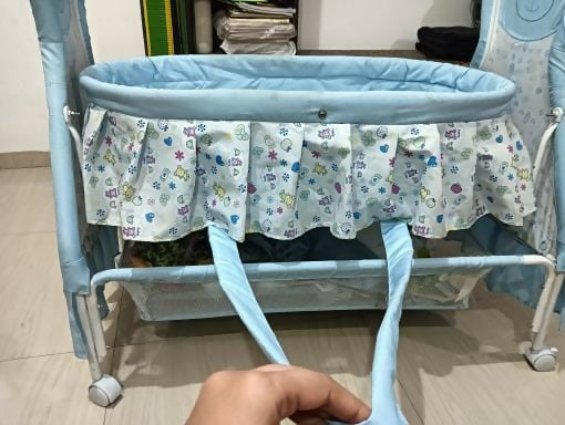 Provide your baby with a cozy, safe, and stylish sleeping space with the Mandot Impex 1st Step Cradle, complete with a swing, mosquito net, and storage basket!