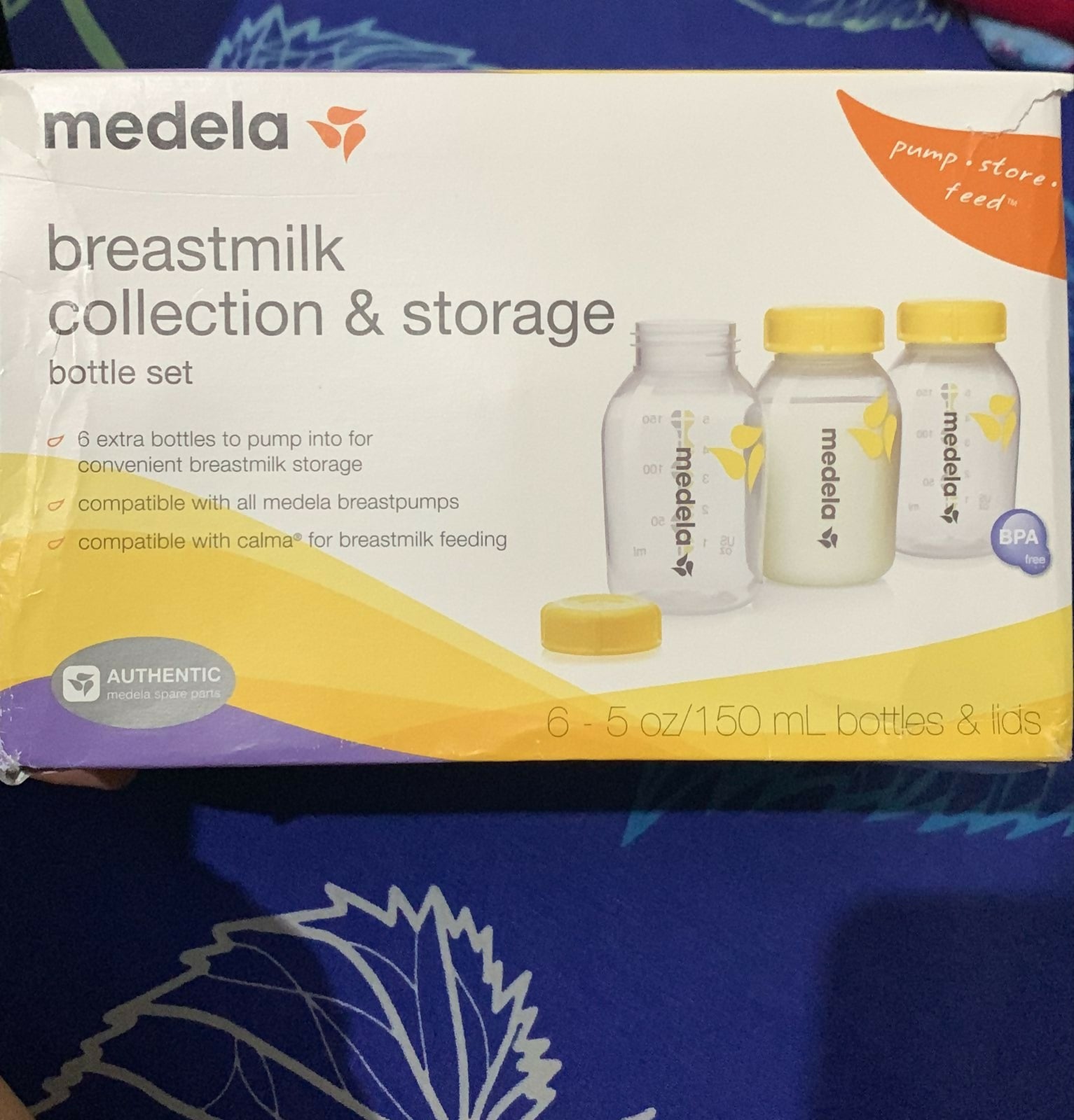 Efficient MEDELA double electric breast pump with 10 bottles, ideal for quick breastmilk collection and storage.