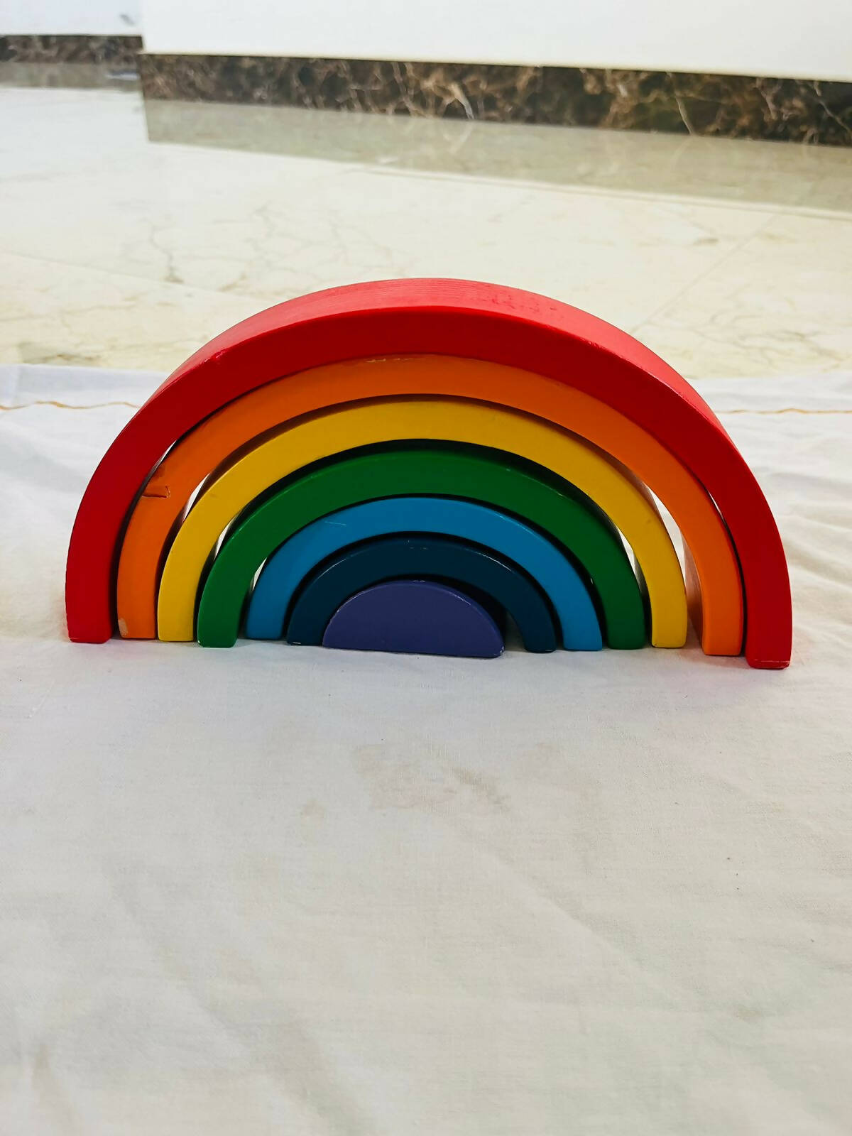 Explore colors and develop skills with our Rainbow Stacker Game - a fun and educational toy for little learners!