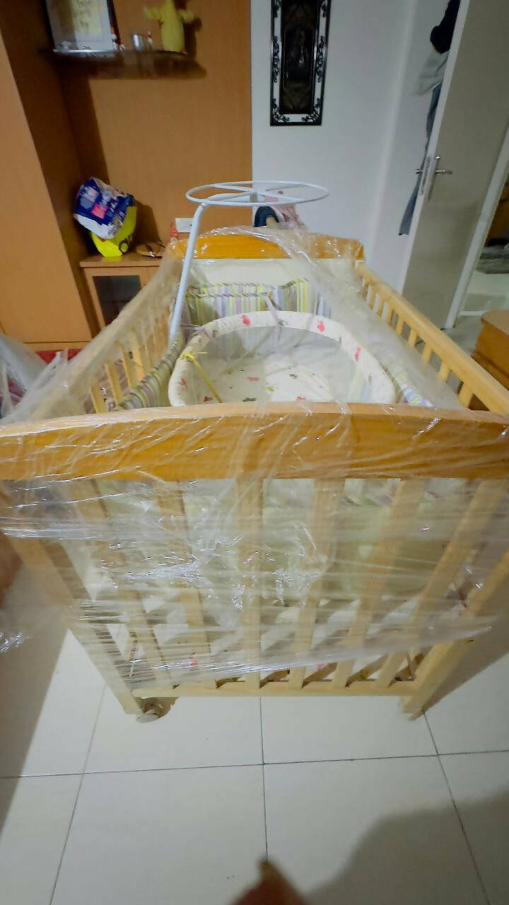 Create a safe haven for your baby with our durable and stylish cot - easy assembly, premium materials, and mosquito net included!